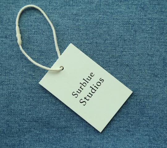 China new design high quality luxury thick paper letterpress hang tags